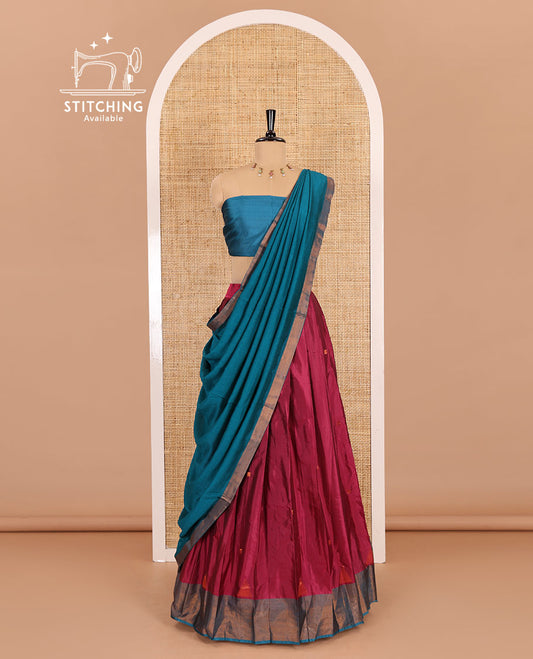 Rani pink and blue half-saree, buttas with traditional zari bordered taffeta silk skirt, a plain blouse, and a contrast vichitra silk dhavani