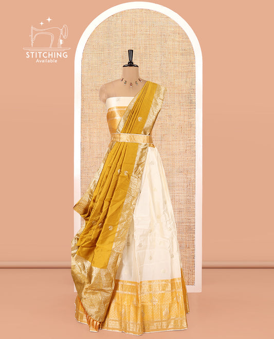 Cream-Yellow Semi-Banarasi Half-Saree Set Featuring Buttas Skirt, Contrast Traditional Border, Matching Blouse, and Banaras Dhavani