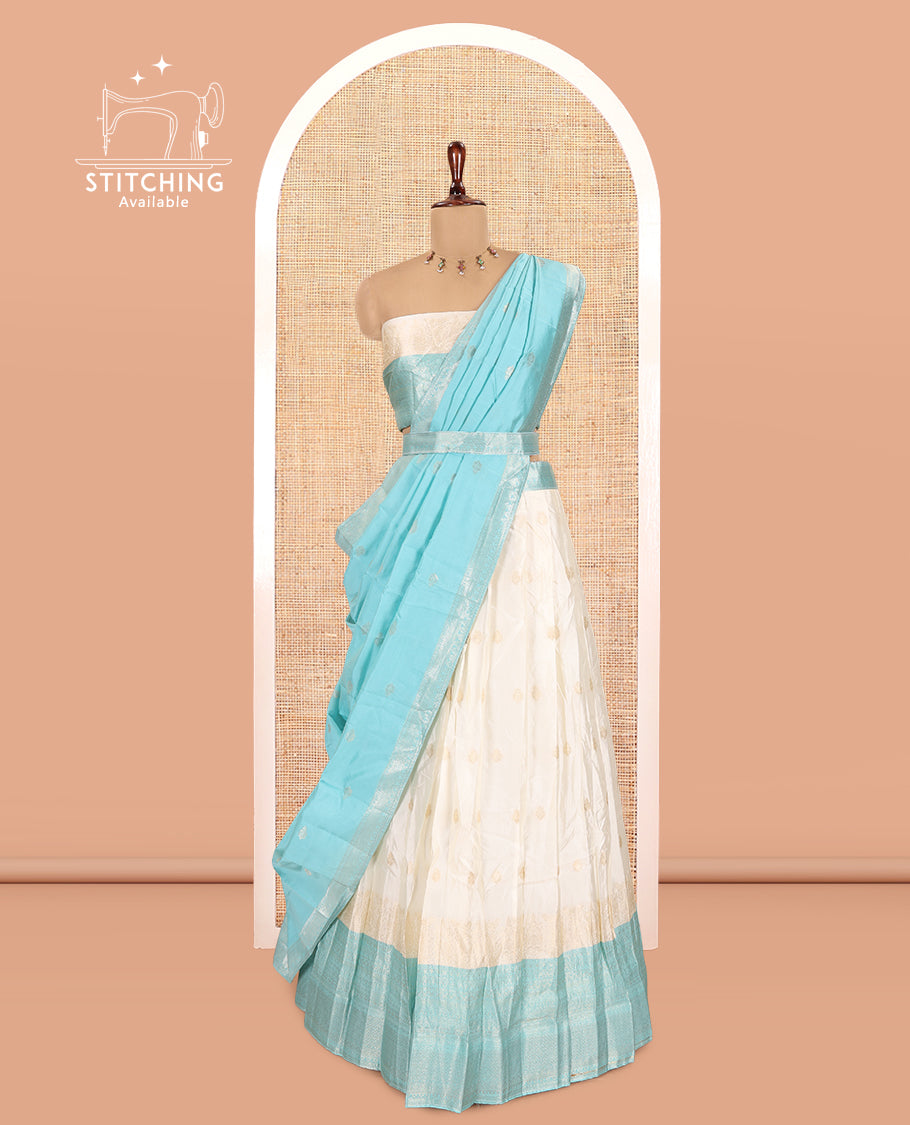 Cream-Blue Semi-Silk Half-Saree, Subtly Sparkled with Zari Buttas Skirt, a Contrast Traditional Zari Border, and a Contrast Dhavani