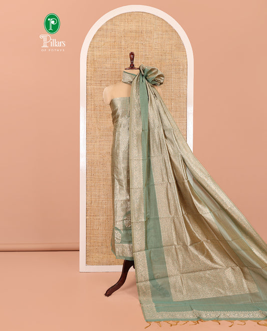 Green Banarasi Material Chudidar Features Jacquard Top, a Matching Santoon Bottom, and an Intricately Designed Dupatta