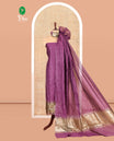Dark Purple Banarasi Chanderi Material Churidar Features Zari Buttas Top, a Plain Bottom, and a Matching Dupatta
