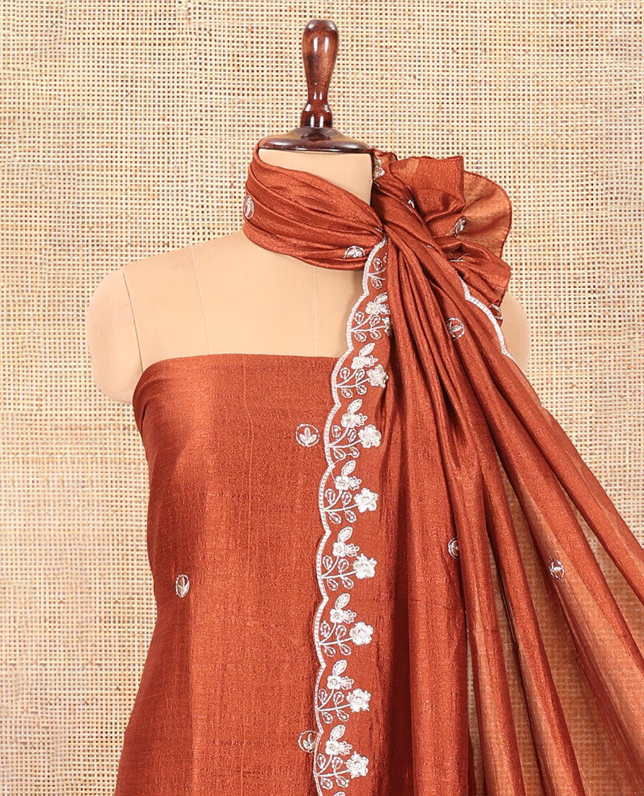 Rust Semi-Silk Material Churidar Features a Floral Embroidered Top, a Matching Bottom, Embroidered Dupatta
