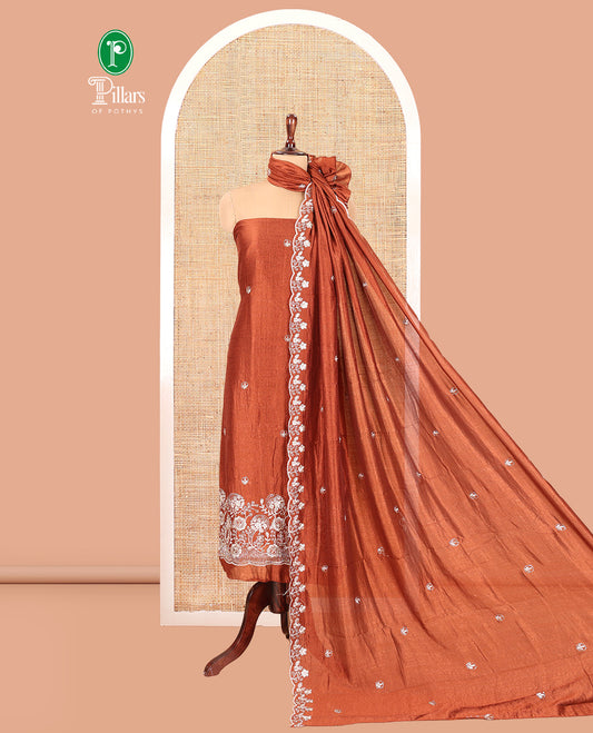 Rust Semi-Silk Material Churidar Features a Floral Embroidered Top, a Matching Bottom, Embroidered Dupatta