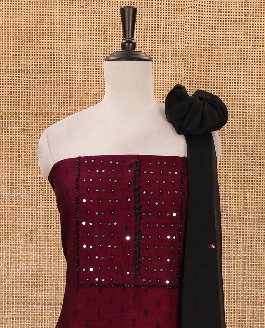 Wine material chudidar set, black beads & mirror neck embroidered with buttas woven vichitra silk top, santoon bottom & contrast mirror work chiffon dupatta