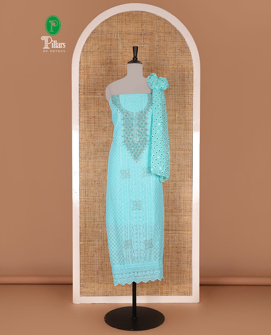 Aqua green material churidar set, stone work with Schiffli style embroidered georgette top, American Crape bottom, and polka dotted printed mirror work dupatta