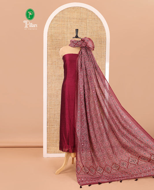 Magenta material chudidar set, plain Vichitra silk top, santoon bottom, and dupatta of Ajrakh print and mirror work