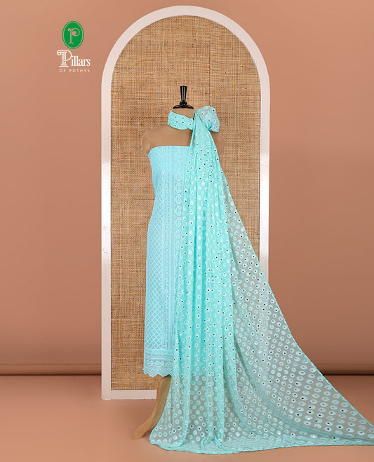 Persian green material chudidar set, paisleys and jaal schiffli sequins embroidered mul georgette top, a matching bottom, and a mirror work dupatta