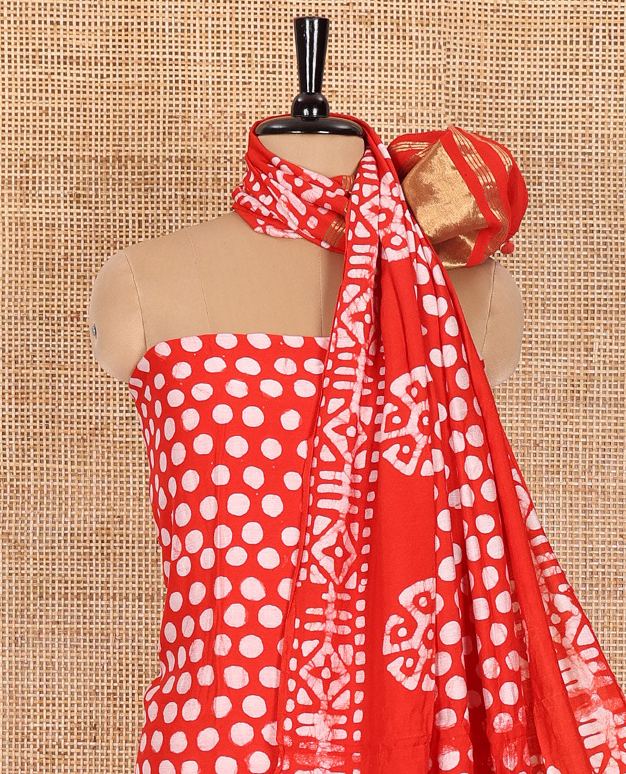 Chilli red material chudidar set, polka dots batik printed modal chanderi top, batik motifs printed bottom, and a batik motifs printed modal chanderi dupatta