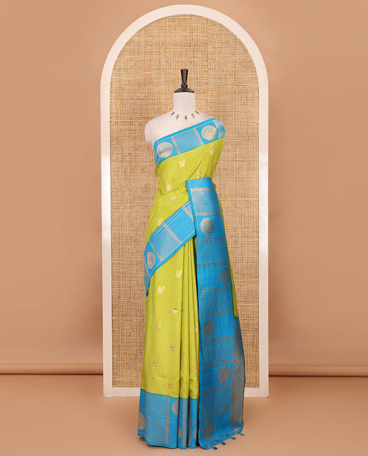 Parrot green peacock buttas dola silk saree, contrast kanchipuram-style traditional zari border, zari pallu & contrast zari border blouse