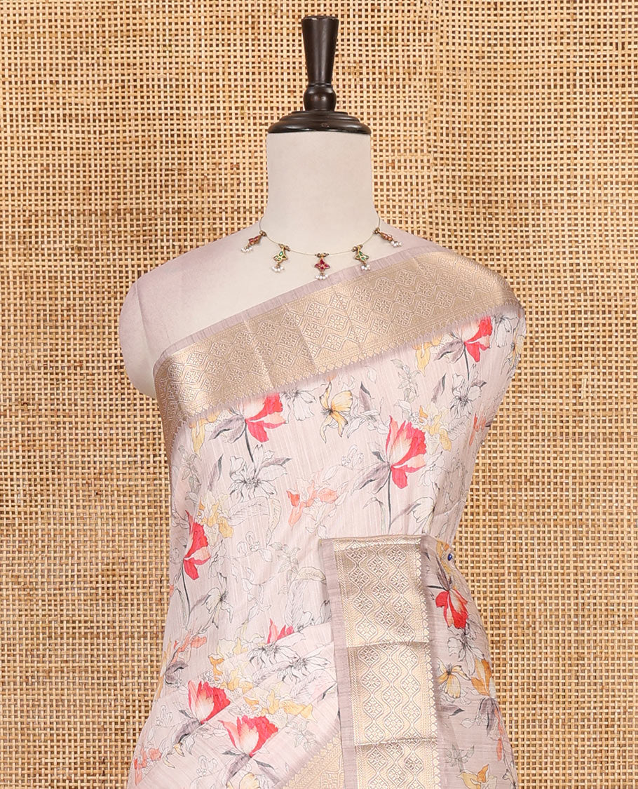 Light peach floral motifs printed fancy tussar saree, ogee patterned zari border,  plain pallu, and plain matching blouse
