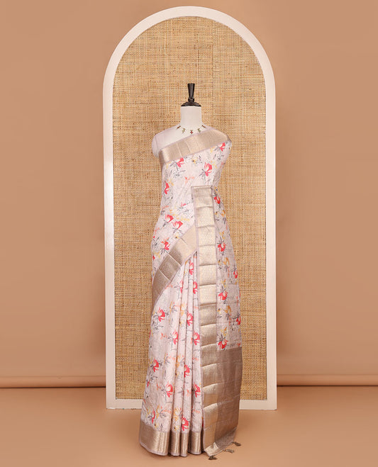 Light peach floral motifs printed fancy tussar saree, ogee patterned zari border,  plain pallu, and plain matching blouse