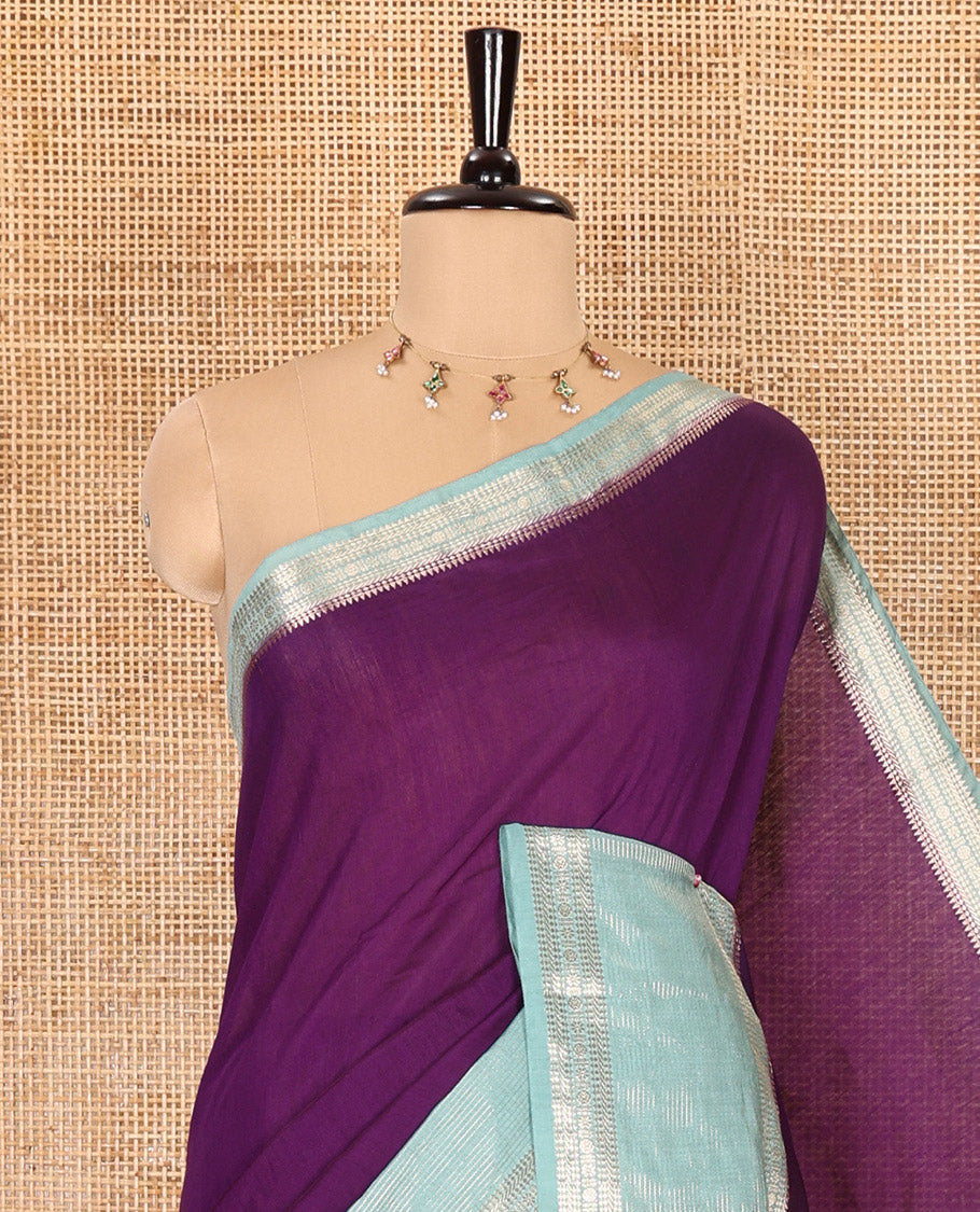 Purple plain Assam silk saree, contrast traditional zari border of rudraksham motifs, zari striped pallu, and a contrast zari bordered blouse
