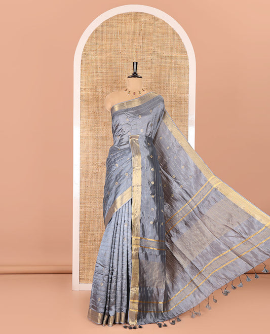 Grey zari buttas and striped banana pith saree, bavanji border, zari striped pallu, and a matching blouse