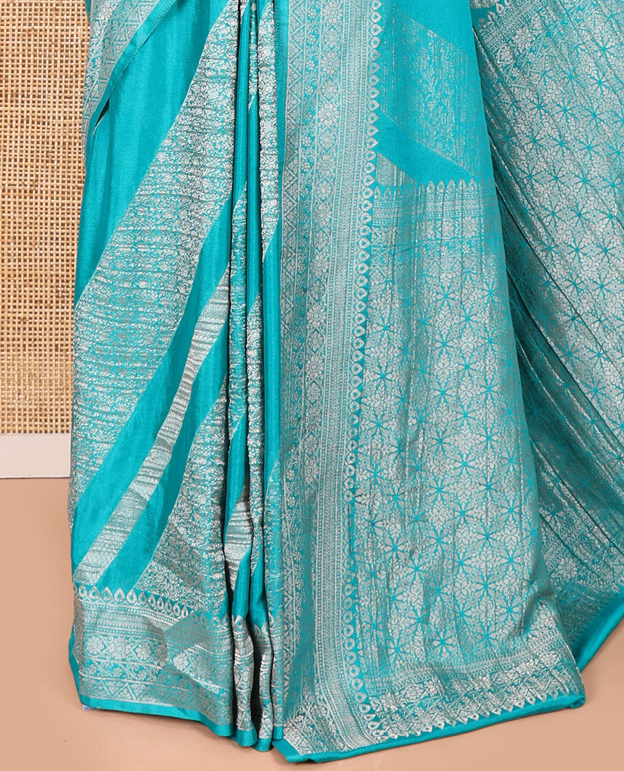 Rama green geometric and intricate designs zari woven fancy crepe saree, traditional zari border, floral-star gridded pallu, and a matching blouse