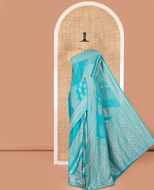 Rama green geometric and intricate designs zari woven fancy crepe saree, traditional zari border, floral-star gridded pallu, and a matching blouse