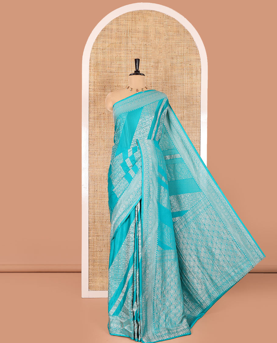 Rama green geometric and intricate designs zari woven fancy crepe saree, traditional zari border, floral-star gridded pallu, and a matching blouse
