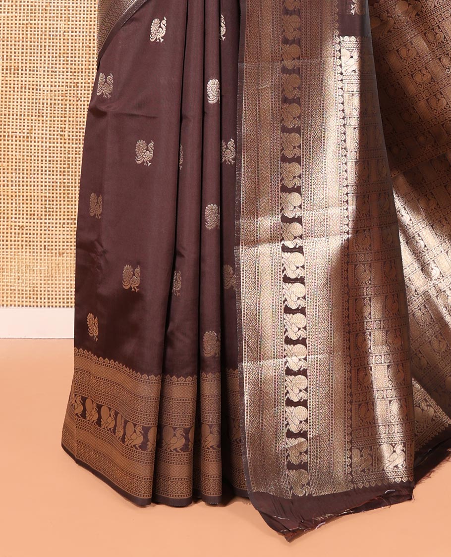 Coffee Brown Litchi Silk Saree, Richly Detailed with Peacock Buttas All Over Its Body, Highlighted by a Traditional Zari Border of Peacock Designs, Grand Pallu of Butta Enclosed Zari Checks, and Paired with a Matching Blouse