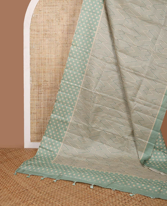 Green geometrical print, zari butta fancy tussar saree with polka dot border & polka dot pallu along with polka dot blouse