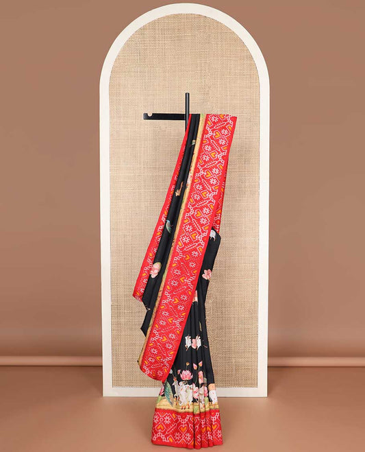 Black pichwai style design printed silk saree with contrast floral design & ikkat style floral design pallu