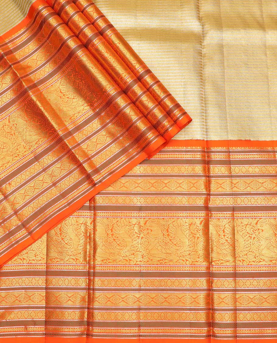 Light yellow striped silk half saree with contrast border of banaras, kathir, poo chakram, mayil design, zari design blouse & intricate zari design dhavani