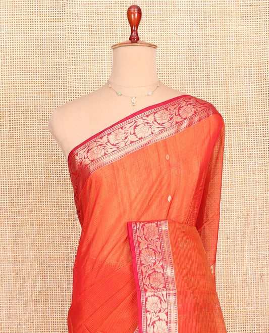 Orange Silk Cotton Saree, Ornamented with Zari Buttas All Over Its Body, Complemented by a Contrast Floral Creeper Zari Design Border, Pallu of Floral Zari Designs, and Paired with a Contrast Blouse
