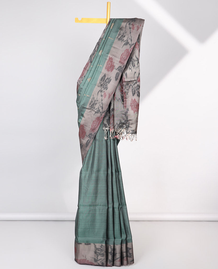 Green floral motifs semi-soft silk saree with contrast border & floral vine design pallu