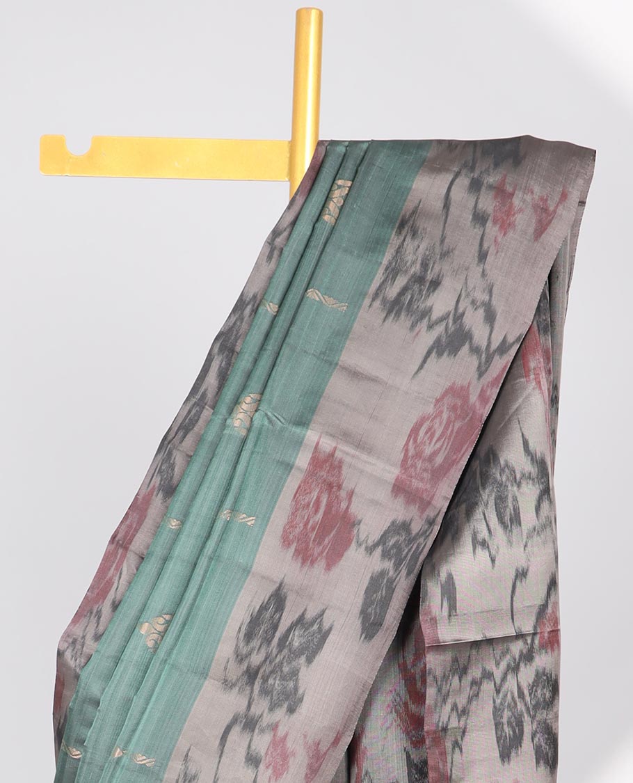 Green floral motifs semi-soft silk saree with contrast border & floral vine design pallu
