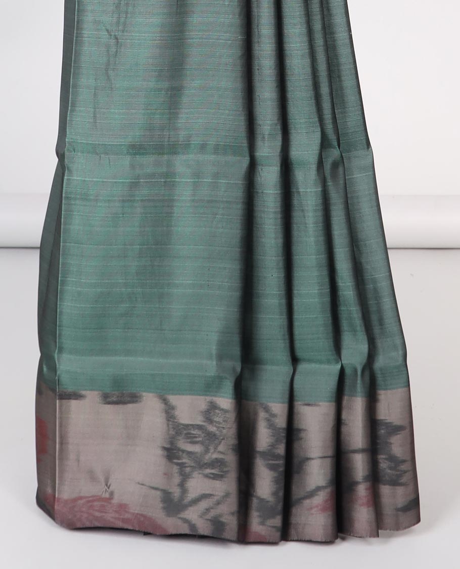 Green floral motifs semi-soft silk saree with contrast border & floral vine design pallu