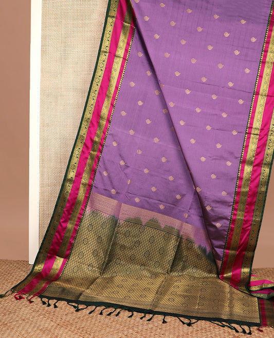Purple zari buttas soft silk saree, contrast traditional design zari rettai pettu border, and intricate pallu