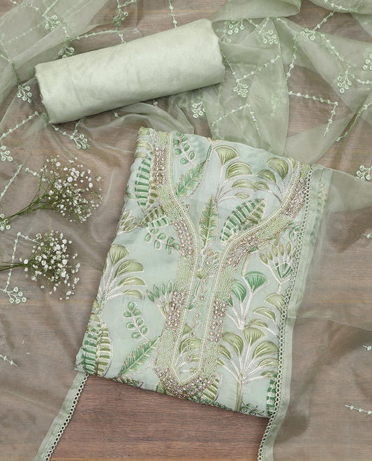 Green material chudidar set, tropical printed with neck embroidered top, plain bottom, and thread embroidered dupatta