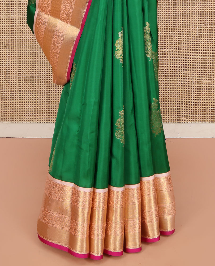 Green Vasundhara Lite Silk Mix Saree, Accentuated with Zari Buttas All Over Its Body, Complemented by a Contrast Border of Muthu, Kodi Visiry, and Mayil Kann Designs, Pallu Steeped with Stripes and Thilakam Designs, and Paired with a Contrast Blouse