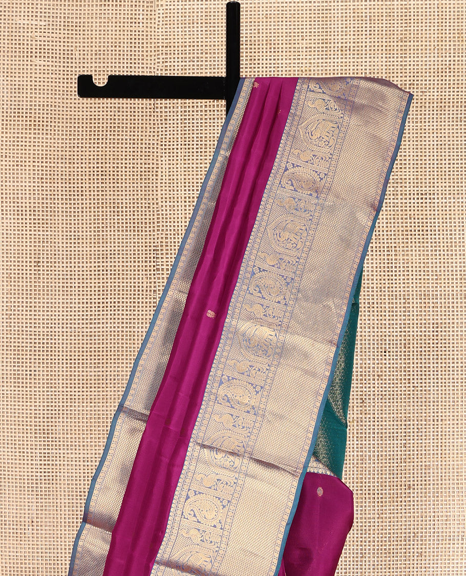 Magenta Vasundhara Lite Silk Mix Saree, Gleamed Up with Zari Buttas, a Contrast Border of Thilakam Mokku, Poun, Arumbu Manga, and Kuyil Kann, Grand Pallu, and a Contrast Blouse