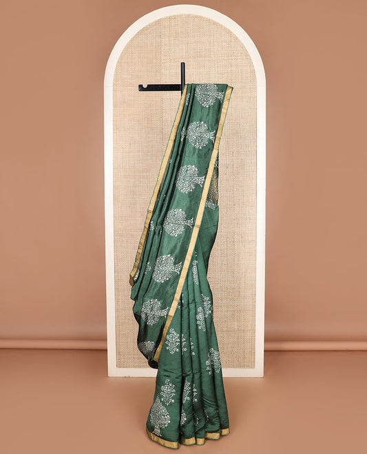 Green tree motifs printed banana pith saree, zari border, and floral printed pallu