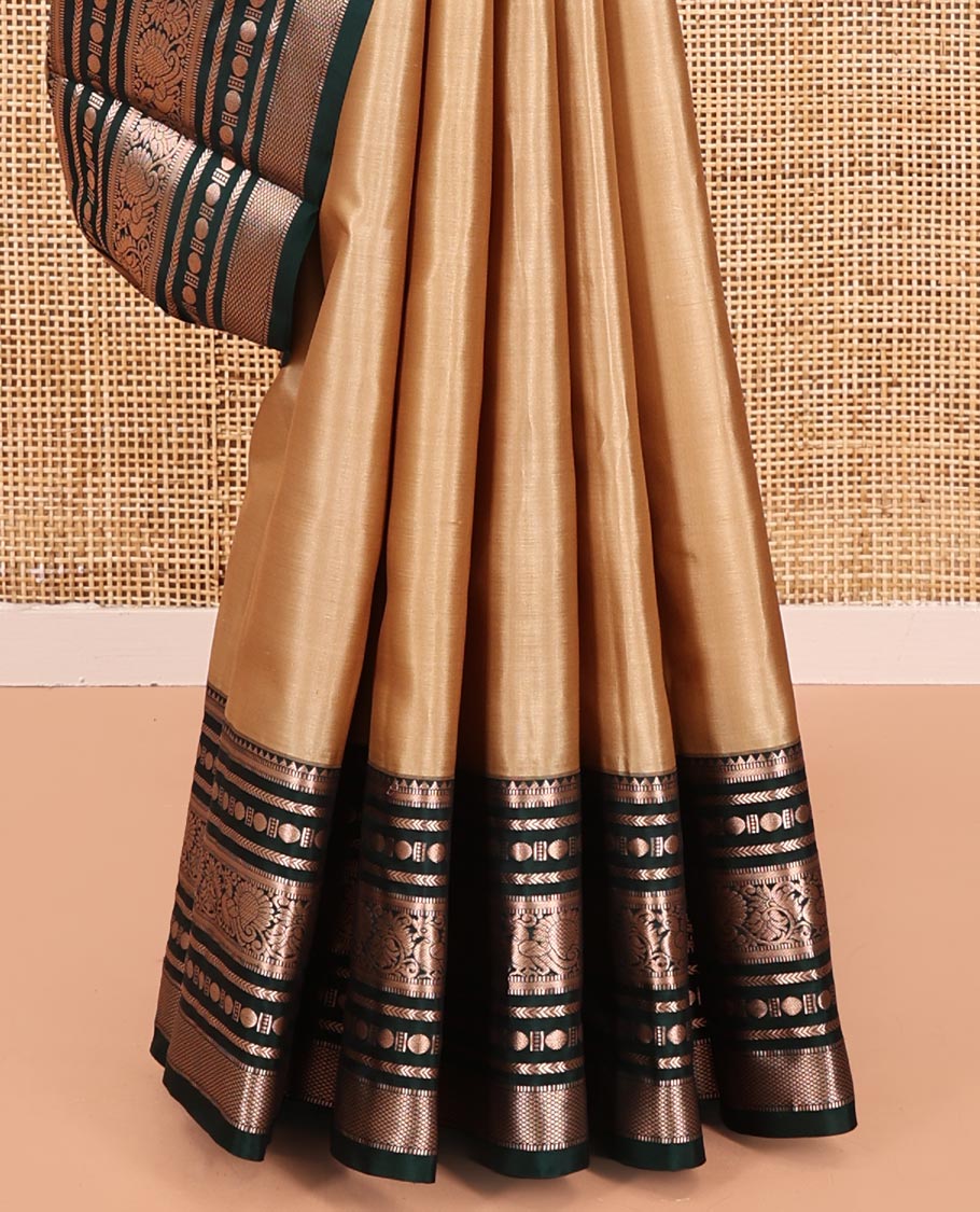 Gold Vasundhara Silk Saree, Bedecked with Zari Buttas All Over Its Body, Complemented by a Contrast  Border of Rekku, Muthu, Kathir, Poun, Mayil, and Mayil Kann Designs, Grand Jaal Pallu, and Paired with a Contrast Blouse