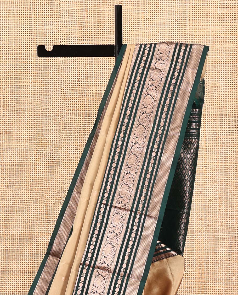Gold Vasundhara Silk Saree, Bedecked with Zari Buttas All Over Its Body, Complemented by a Contrast  Border of Rekku, Muthu, Kathir, Poun, Mayil, and Mayil Kann Designs, Grand Jaal Pallu, and Paired with a Contrast Blouse
