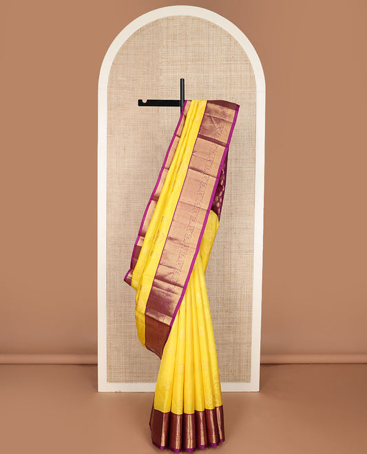 Yellow floral buttas silk saree, contrast border of salangai, ara bogudi, mayil kann & kodi visiry & seppu rekku pallu of floral motifs