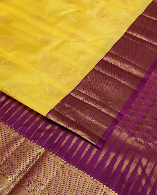 Yellow floral buttas silk saree, contrast border of salangai, ara bogudi, mayil kann & kodi visiry & seppu rekku pallu of floral motifs