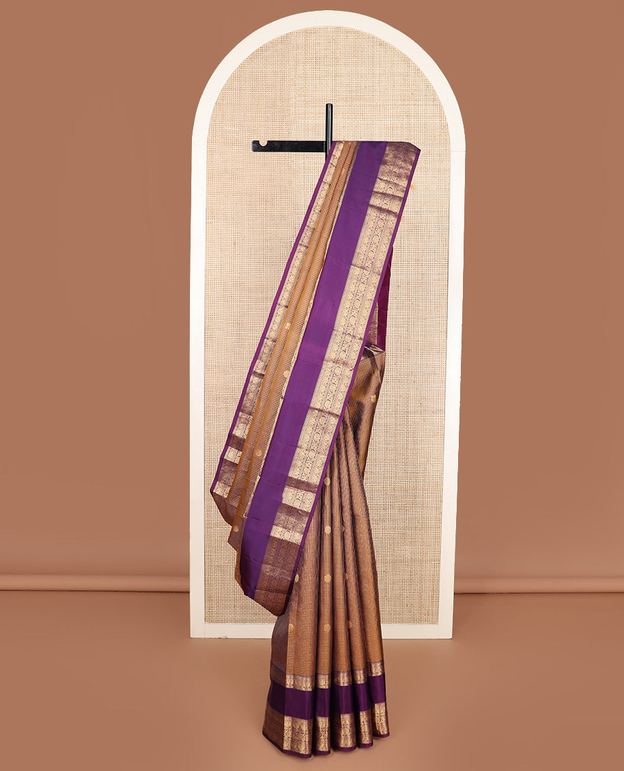 Brown micro-checked with annam chakram buttas silk saree, contrast rettai pettu border of ara bogudi, muthu, banaras,iruthalai pakshi and poo chakram, and jaal design pallu