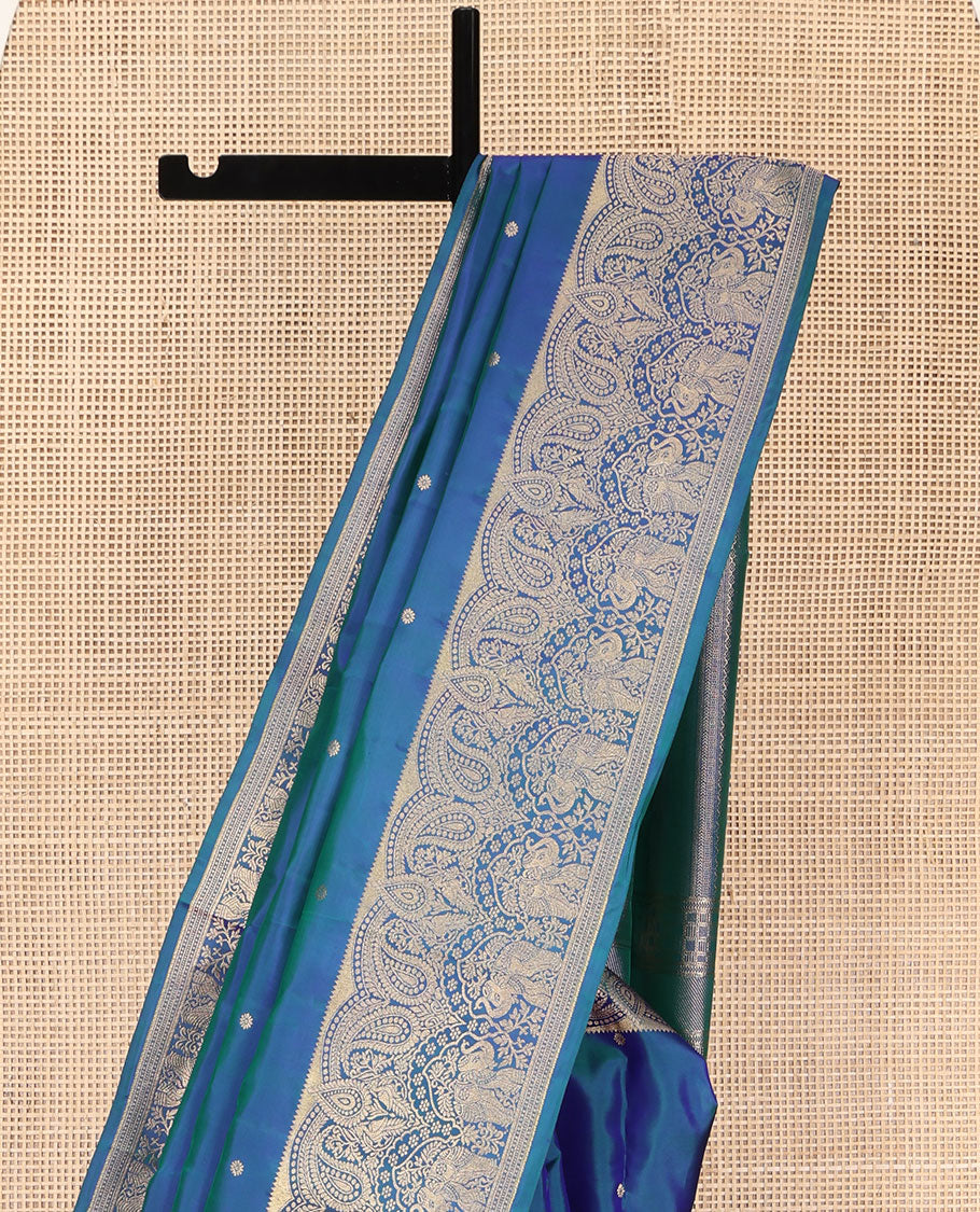 Blue Vasundhara Silk Saree, Accentuated with Zari Buttas All Over Its Body, Highlighted by a Zari Border of Manga and Yaanai Designs, Grand Geometric Patterned Pallu, and Paired with a Matching Blouse