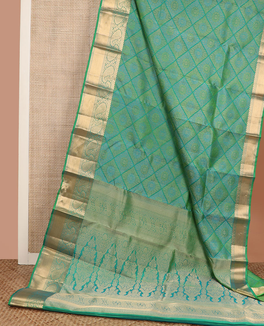 Green jacquard Kanchipuram wedding silk saree, zari border of arumbu manga designs, and intricate pallu