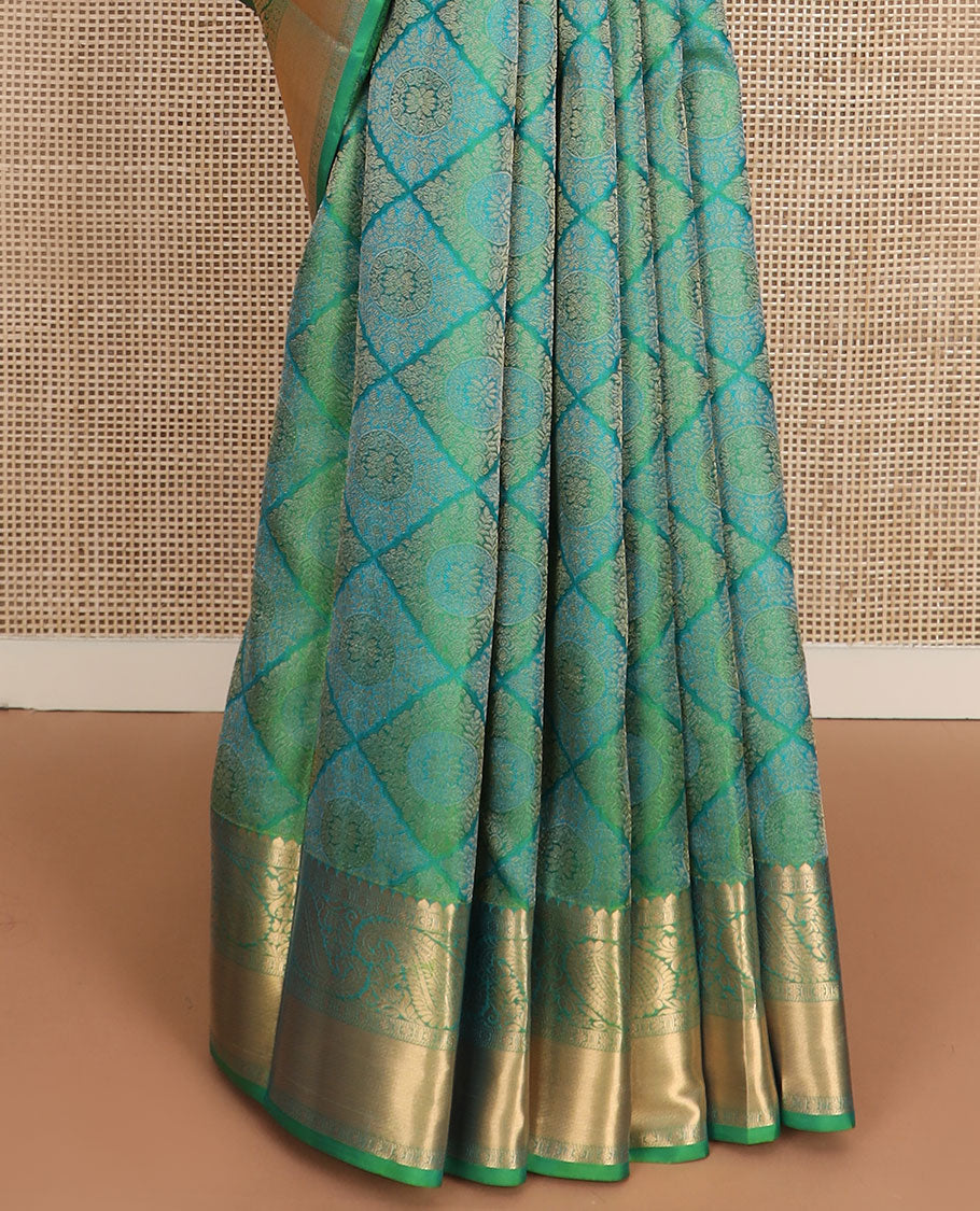 Green jacquard Kanchipuram wedding silk saree, zari border of arumbu manga designs, and intricate pallu