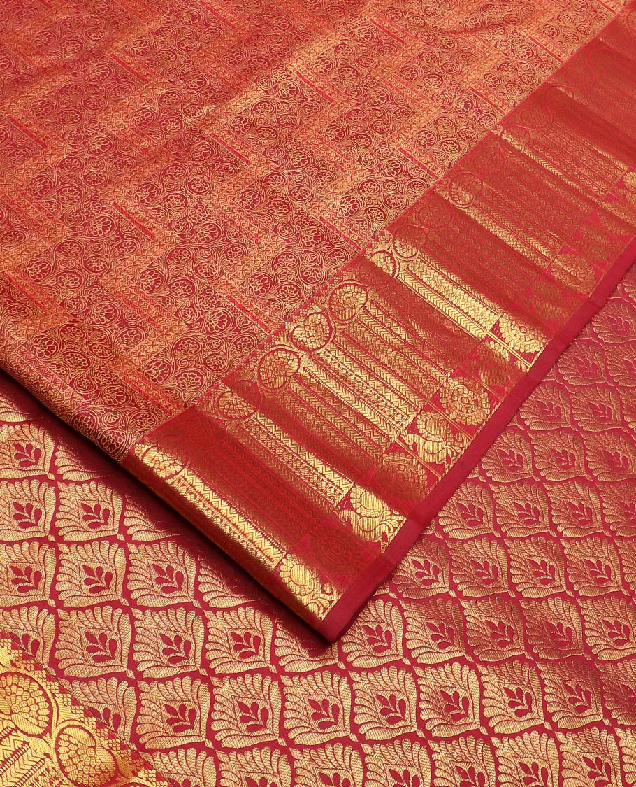 Light maroon jacquard Kanchipuram wedding silk saree, zari border of dhavana kodi, kathir, and mayil chakram, and ogee patterned pallu