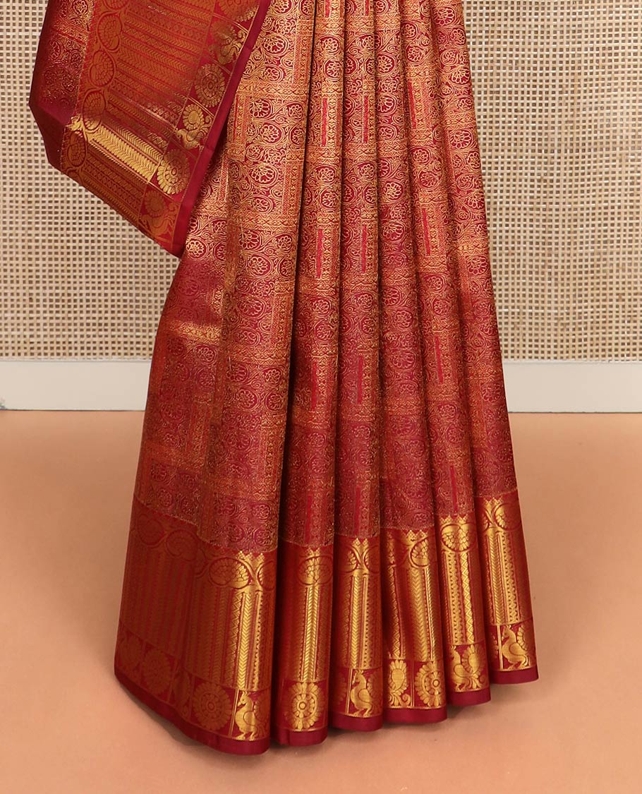 Light maroon jacquard Kanchipuram wedding silk saree, zari border of dhavana kodi, kathir, and mayil chakram, and ogee patterned pallu
