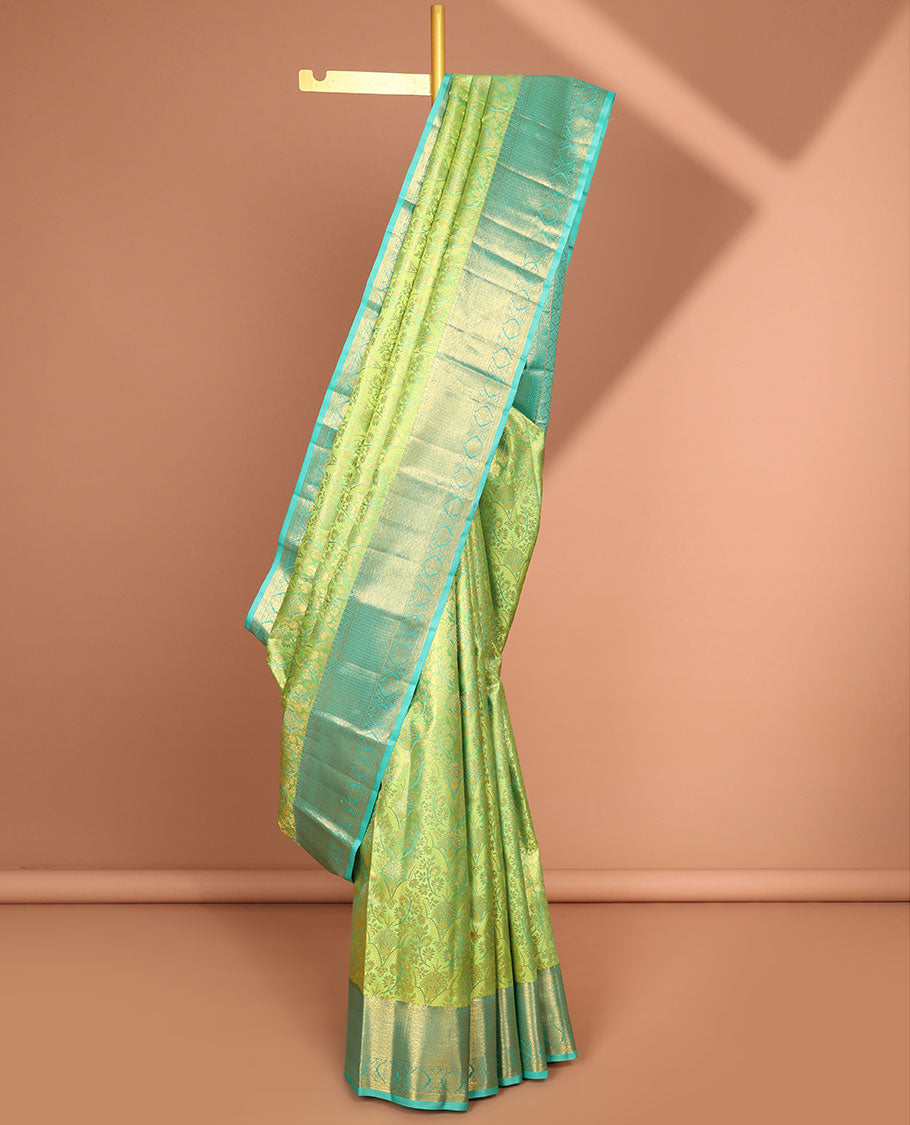 Green floral jacquard kancheepuram silk saree with contrast zari design border & argyle design pallu