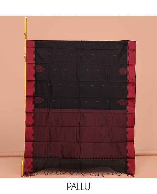 Black Semi-Silk Cotton Saree, Delicately Designed with Buttas All Over Its Body, Complimented by Contrast Temple Border, Plain Pallu, and Paired with a Matching Blouse