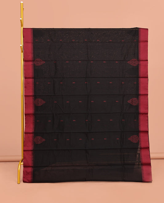 Black Semi-Silk Cotton Saree, Delicately Designed with Buttas All Over Its Body, Complimented by Contrast Temple Border, Plain Pallu, and Paired with a Matching Blouse