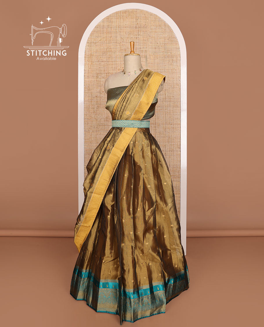 Bronze color buttas tissue half saree with contrast zari design border, floral design blouse & floral design dhavani