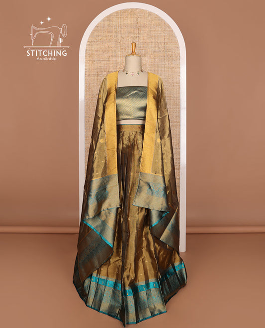 Bronze color buttas tissue half saree with contrast zari design border, floral design blouse & floral design dhavani