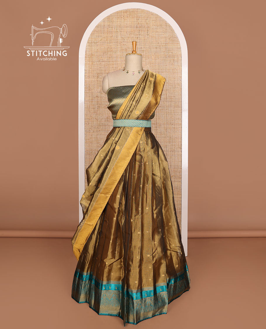 Bronze color buttas tissue half saree with contrast zari design border, floral design blouse & floral design dhavani