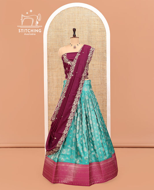 Green Art Silk Half Saree Features Buttas Steeped Skirt, Complemented by Contrast Traditional Border, Contrast Blouse, and a Embroidery Scallop Dhavani
